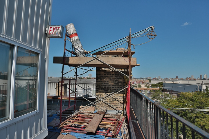 Tuckpointing project including lowering an unused chimney at the top of the Tannery Lofts Condo Association